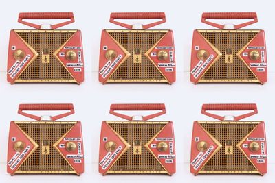 Array of images showing World Radio, a vintage orange AM radio turned conceptual product.